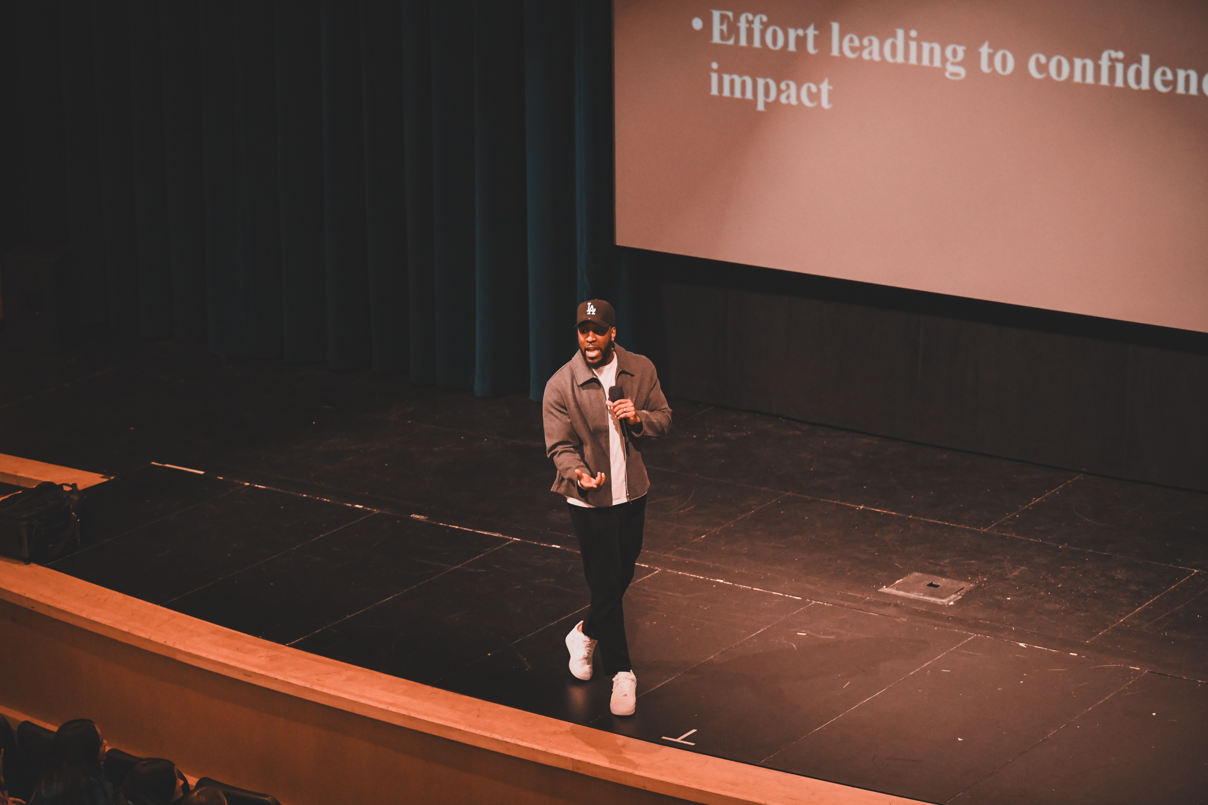 Julian speaking on stage